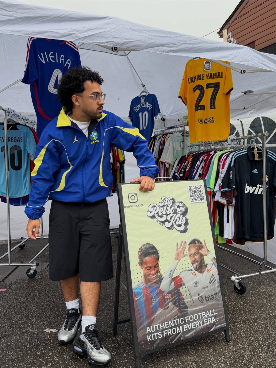 The Myretrokits pop-up stall: racks of football shirts under a tent beside a sign reading Authentic football kits from every era