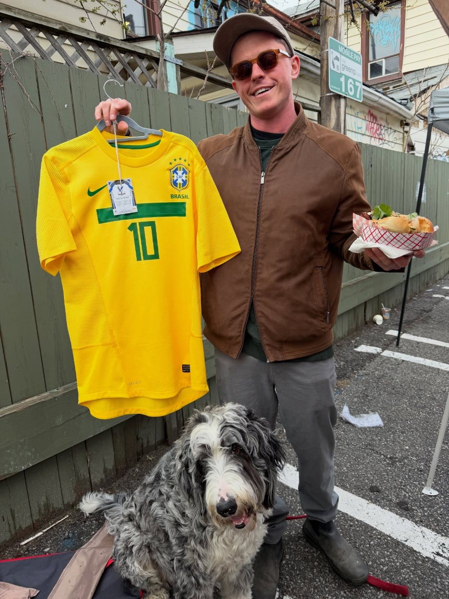 A customer and his dog with an England Umbro training top he bought