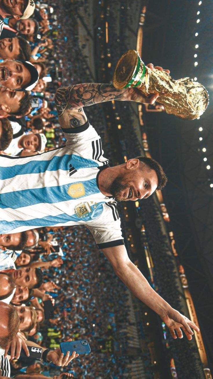 Messi holding the World Cup trophy